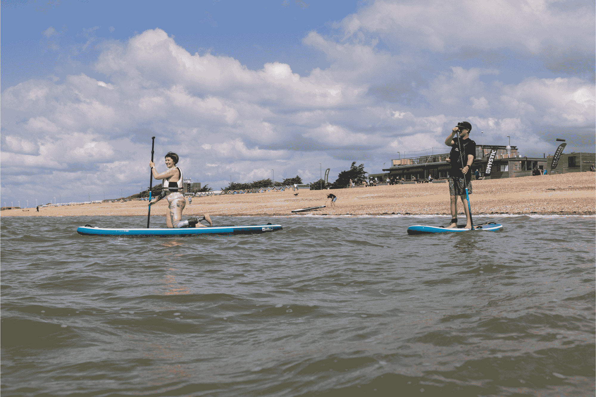 Beach watersports activities: paddleboarding