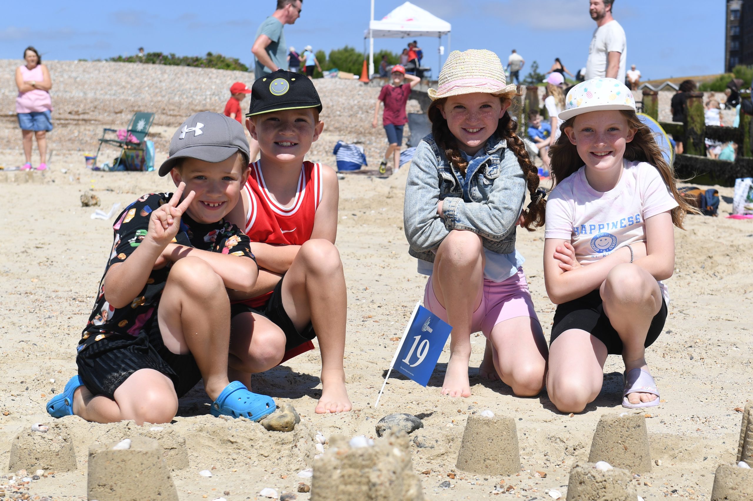 Littlehampton Sandcastle competition 2024. Children making sand sculptures.